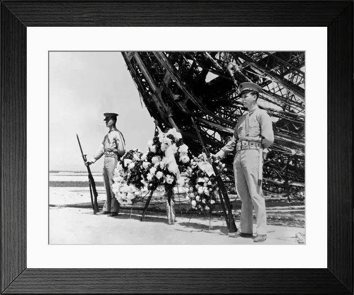 Framed Print : Hindenburg dead are honored on Memorial Day. Two U.S. Marines stand guard at the wreath place at the prow of the ill-fated dirigible