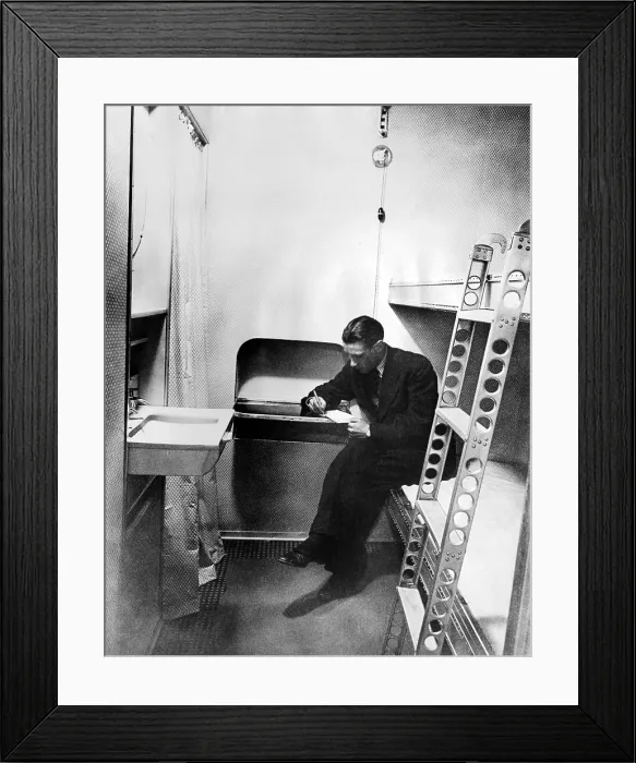 Framed Print : Stateroom on the dirigible, Hindenburg. The cabin is equipped with hot and cold running water, upper and lower bunks, and a built in writing table. March 17, 1936 Framed Print : Stateroom on the dirigible, Hindenburg. The cabin is equipped with hot and cold running water, upper and lower bunks, and a built in writing table. March 17, 1936