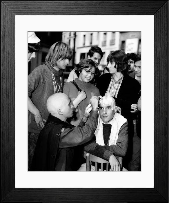 Framed Print : New hair fashions for the Parisian counterculture. Some beatniks are trading in their long hair for shaved heads. July 30, 1966 Framed Print : New hair fashions for the Parisian counterculture. Some beatniks are trading in their long hair for shaved heads. July 30, 1966