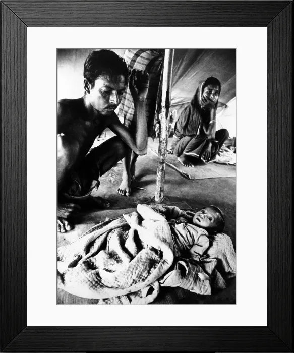 Framed Print : Father's vigil over his dying son in a refugee camp during the Bangladesh Liberation War in 1971