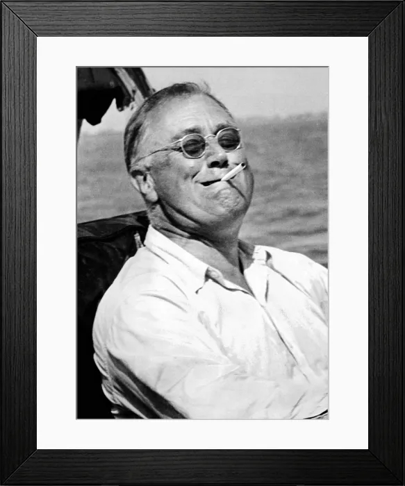 Framed Print : President Franklin Roosevelt smokes a cigarette while fishing for tarpon during his vacation on the Gulf of Mexico. May 10, 1937. (CSU_ALPHA_141) CSU Archives / Everett Collection