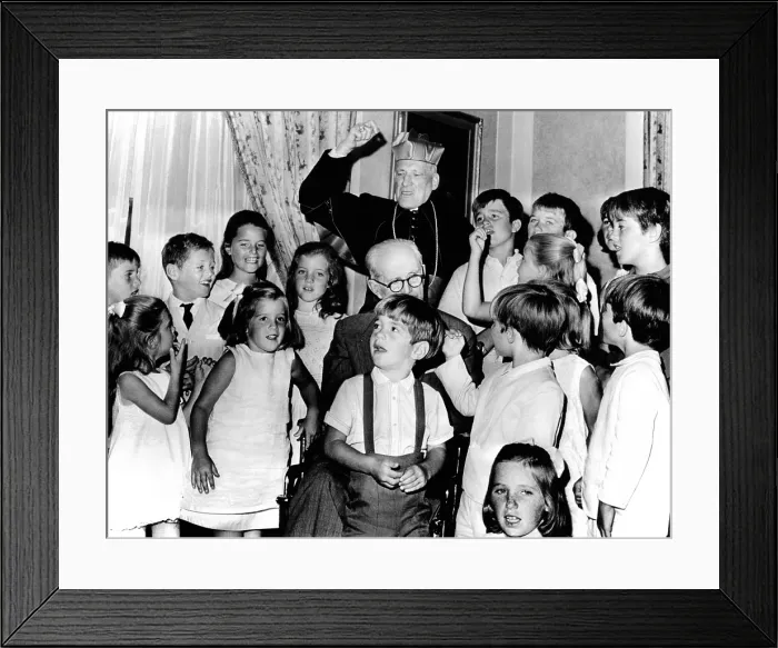 Framed Print : Cardinal Richard Cushing leads the Kennedy children in singing Happy Birthday'. They were celebrating their grandfather's 70th birthday. Former Ambassador Joseph P