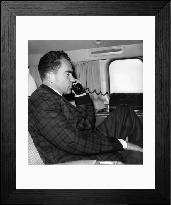 Framed Print : Vice President Richard Nixon uses his plane's radiotelephone while enroute from Quito, Ecuador to Bogota, Columbia. May 1, 1958