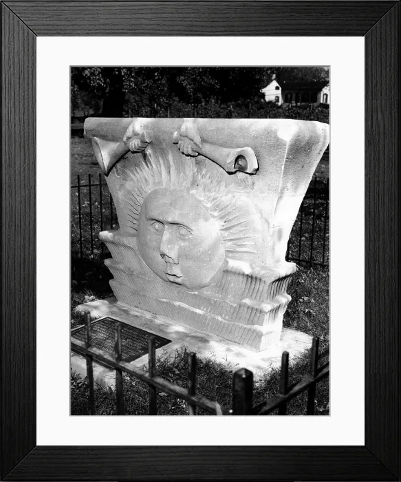 Framed Print : Surviving sunstone at the reconstructed Mormon Temple at Nauvoo, Illinois. It depicts sun face emerging between clouds beneath a pair of hand-held trumpets