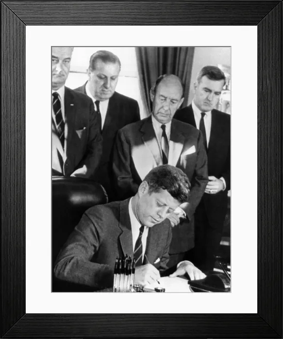 Framed Print : President John Kennedy signs a bill allowing the US to purchase half of the United Nations $200 million bonds. Witnessing L-R: Vice Pres. Lyndon Johnson; Rep