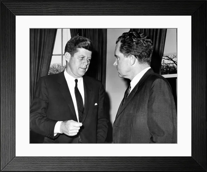 Framed Print : President John Kennedy confers with former Vice President Richard Nixon. They had a 75 minute meeting to discuss the Cuban Crisis caused by the failed Bay of Pigs invasion