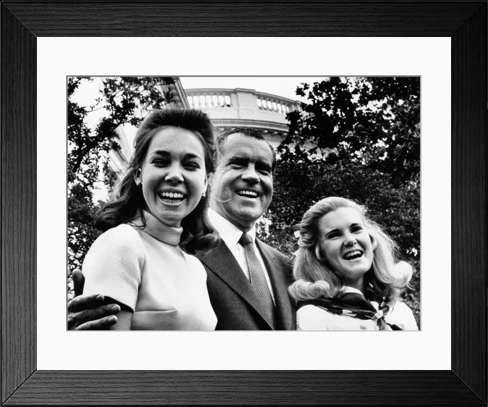 Framed Print : President Nixon poses with his two daughters, Julie Eisenhower and Tricia Nixon in the White House Rose Garden on Father's Day. June 15, 1969