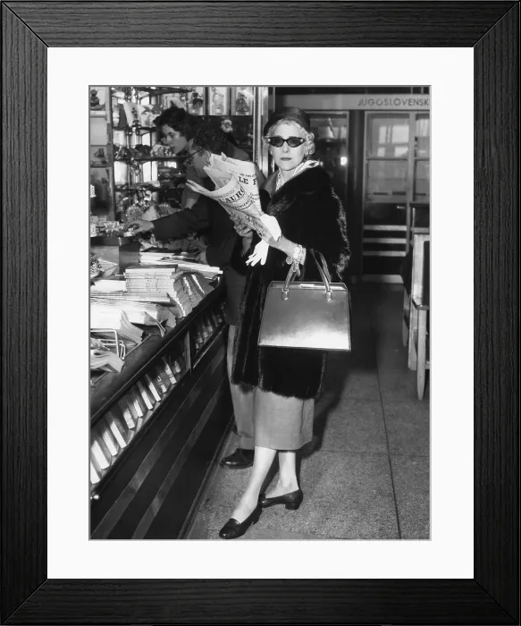 Framed Print : Clare Booth Luce, at a newsstand at Paris Orly Airport before boarding a plane for Rome. Sept. 12, 1957. (CSU_2015_8_588)