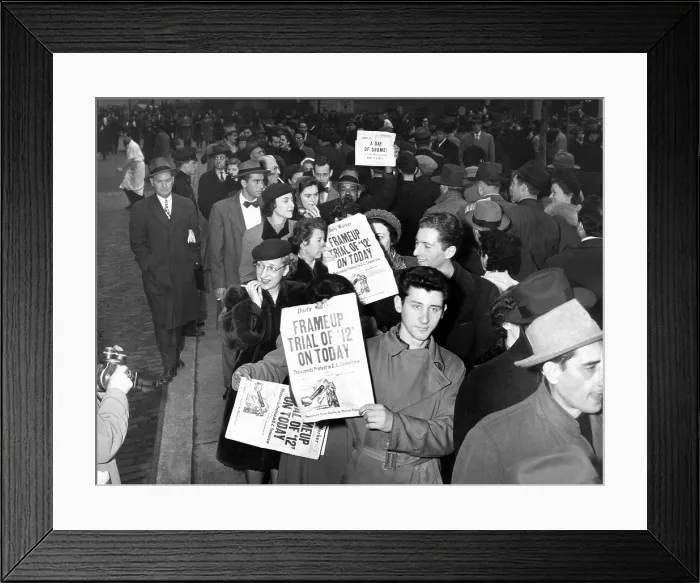 Framed Print : Communist Party members display the headlines of the Daily Worker, which reads. Frame Up Trial of 12 on Today. June 1949