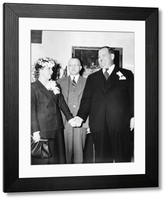 Framed Print : Comedian Oliver Hardy weds studio script girl, Virginia Lucille Jones, in Las Vegas, Nevada. Judge Roger Foley, (center) married them on March 8, 1940 Framed Print : Comedian Oliver Hardy weds studio script girl, Virginia Lucille Jones, in Las Vegas, Nevada. Judge Roger Foley, (center) married them on March 8, 1940