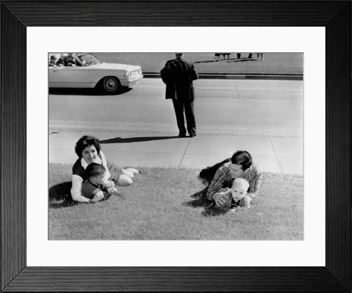 Framed Print : Witnesses to the Kennedy assassination. Frightened spectators drop to the ground after shots were fired at Dealy Plaza during the assassination of President Kennedy