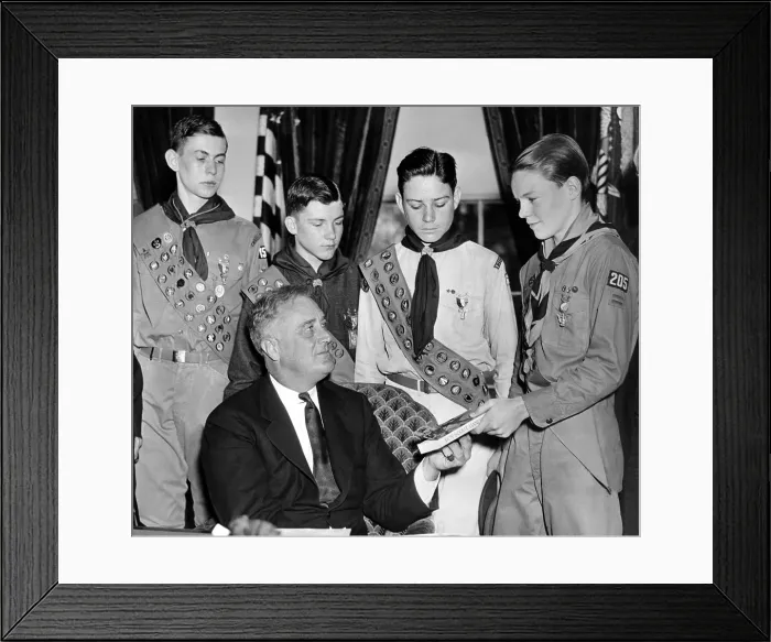Framed Print : President Franklin Roosevelt receives the five-millionth copy of the Boy Scout Handbook. Eagle Scouts presented the special silver and green bound book to FDR on April 13, 1935 Framed Print : President Franklin Roosevelt receives the five-millionth copy of the Boy Scout Handbook. Eagle Scouts presented the special silver and green bound book to FDR on April 13, 1935
