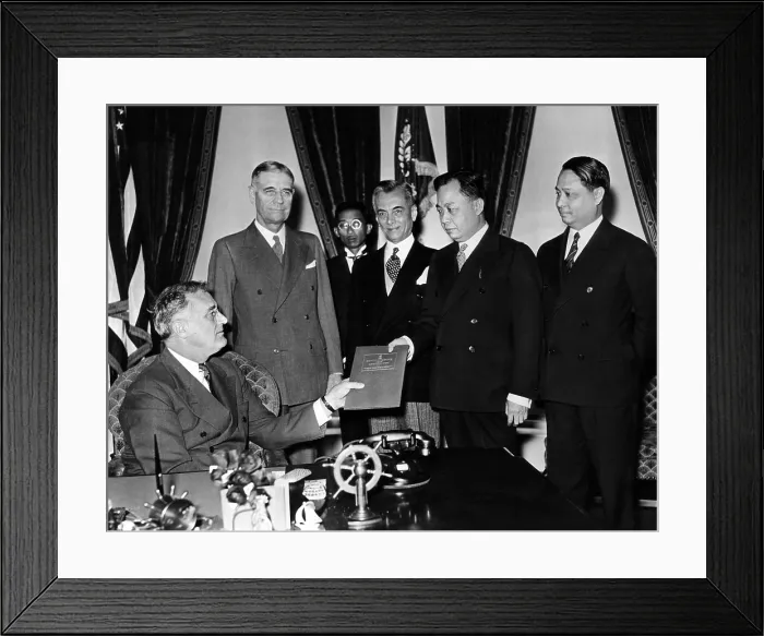 Framed Print : President Franklin Roosevelt is presented the Philippine Constitution for his approval by members of the Philippine Constitutional Convention. Standing L-R: George Dern, Sec