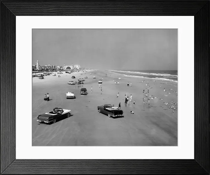 Framed Print : Daytona Beach is 23-mile-long and 600 feet wide. It's smooth, compacted sand is great for cars and vehicles of all types. July 5, 1957
