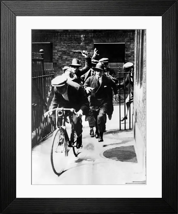 Framed Print : English General Strike. A crowd of strikers chasing a strike breaker (on bicycle) after he had been accused of taking the place of a union laborer. May 4-13, 1926 Framed Print : English General Strike. A crowd of strikers chasing a strike breaker (on bicycle) after he had been accused of taking the place of a union laborer. May 4-13, 1926
