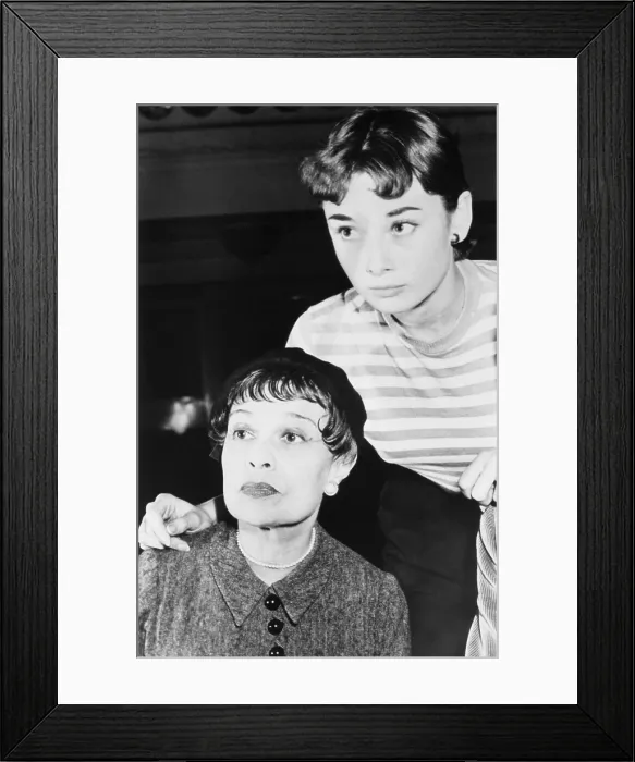 Framed Print : Novelist and playwright, Anita Loos, with actress Audrey Hepburn
