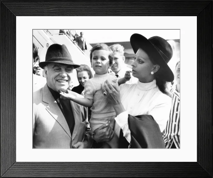 Framed Print : Carlo Ponti, Jr. arrives in New York with his famous parents: Italian film producer, Carlo Ponti Sr. and actress Sophia Loren. Sept. 21, 1970. (CSU_2015_8_616)