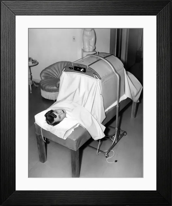 Framed Print : Helena Rubenstein Fifth Avenue Salon. Hair treatment is followed by massage. First, the baking machine where electrically heated blankets augment the infrared heat massage