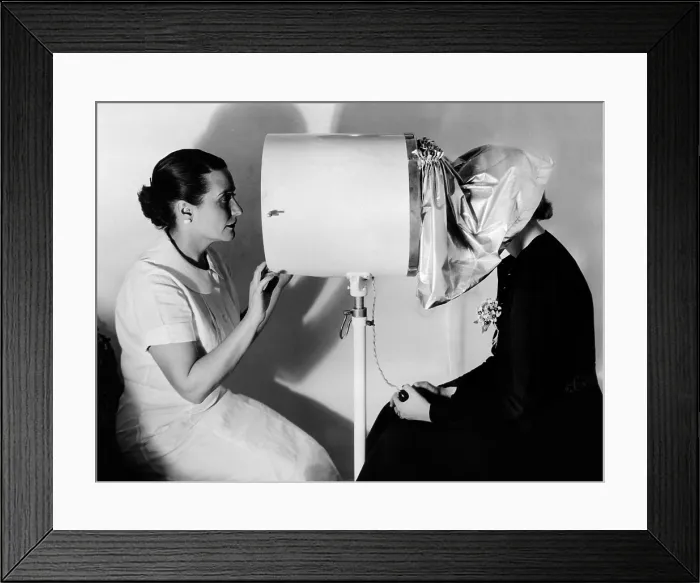 Framed Print : Helena Rubenstein Fifth Avenue Salon. An expert examines the clients skin with Camera-like machine, the Derma Lens Framed Print : Helena Rubenstein Fifth Avenue Salon. An expert examines the clients skin with Camera-like machine, the Derma Lens