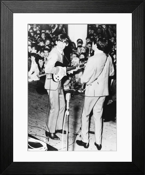 Framed Print : George Harrison (left) and Paul McCartney, of the Beatles perform in Manchester, England. Nov. 11, 1963