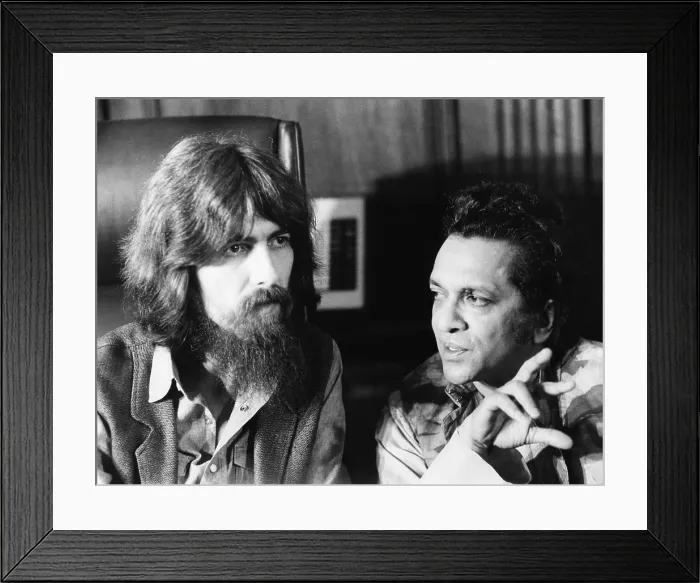 Framed Print : Former Beatle George Harrison (left) and Indian musician Ravi Shankar talk to newsmen in New York. July 27, 1971