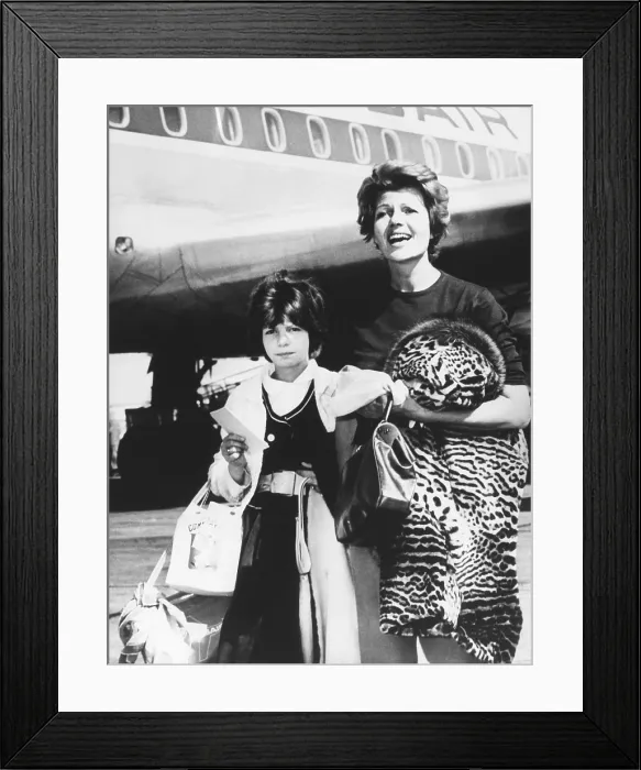 Framed Print : Rita Hayworth and her daughter Princess Yasmin arrive at New York City from Spain. June 3, 1961
