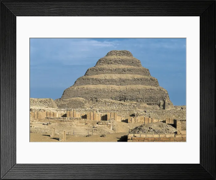 Framed Print : IMHOTEP (ca. 2667 BC-2648 BC). The step pyramid of Djoser. 2668 -2649 BC. EGYPT. Saqqara. Pyramid of Djoser. Pyramid and funerary complex of the Pharaoh. Egyptian art
