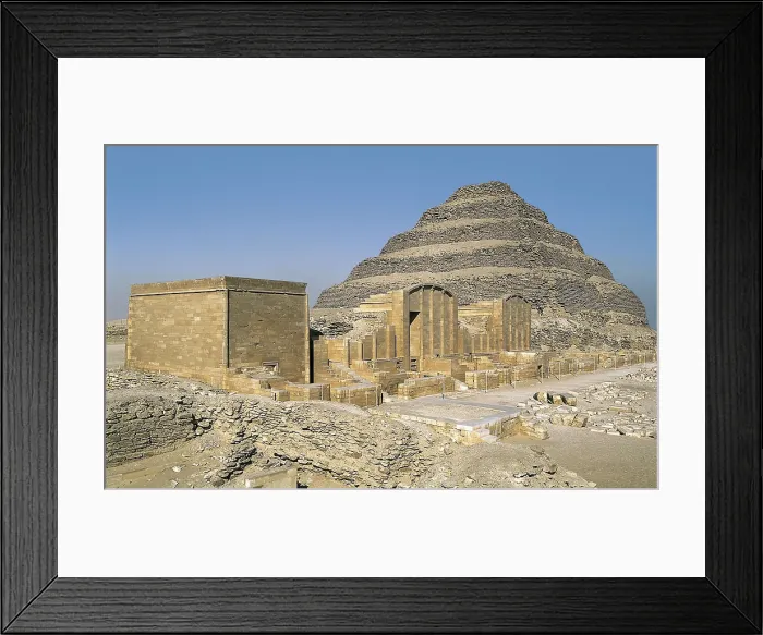 Framed Print : IMHOTEP (ca. 2667 BC-2648 BC). The step pyramid of Djoser. 2668 -2649 BC. EGYPT. CAIRO. Saqqara. Pyramid of Djoser. Pyramid and funerary complex. Egyptian art. Old Kingdom