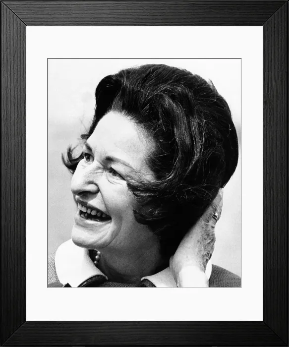 Framed Print : Lady Bird Johnson smiles as the wind disrupts her hairdo. She was visiting the Statue of Liberty to dedicate the American Museum of Immigration