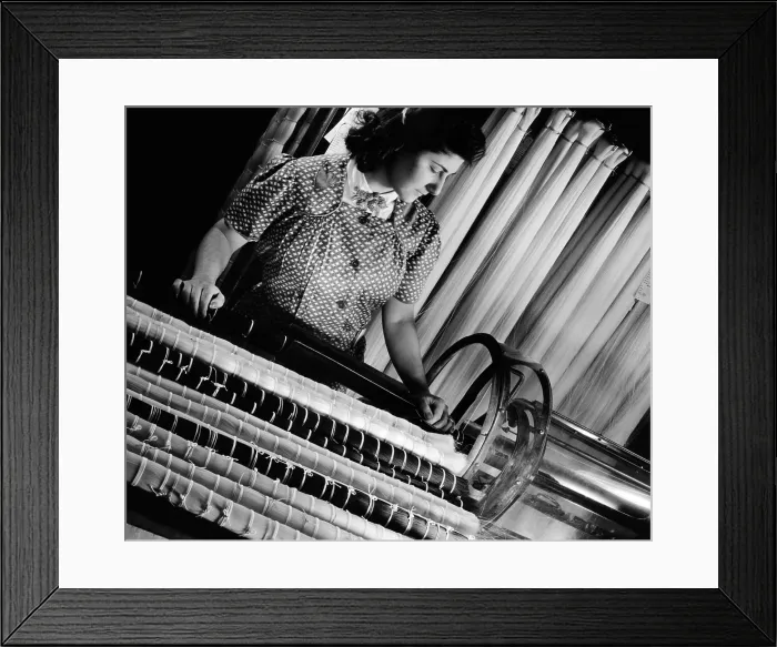 Framed Print : DuPont operator manufacturing nylon products. She is tying nylon hanks in preparation for cutting the filament into short bristle length bundles