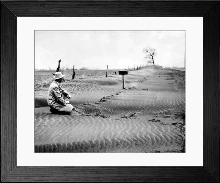 Framed Print : Mid-western farmer sitting in sand dunes along a country road. Sept. 1953. (CSU_ALPHA_1589) CSU Archives / Everett Collection