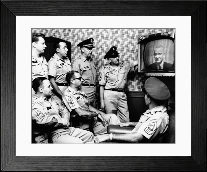 Framed Print : Military men at New York's 71st Street Armory watch President Lyndon Johnson's address on the US build-up in Vietnam. July 28, 1965
