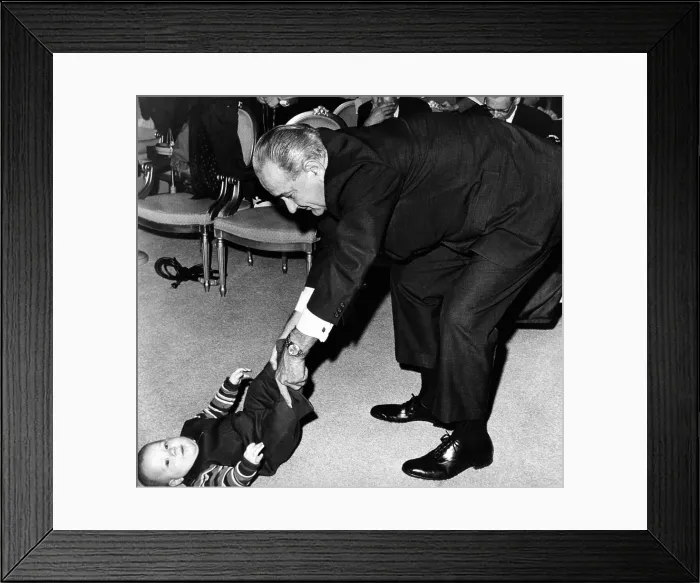 Framed Print : President Lyndon Johnson tugs the legs of his baby grandson, Lyndon Patrick Nugent Framed Print : President Lyndon Johnson tugs the legs of his baby grandson, Lyndon Patrick Nugent