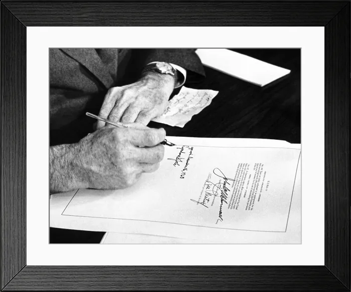 Framed Print : President Lyndon Johnson signs a $102 billion education bill at the White House today