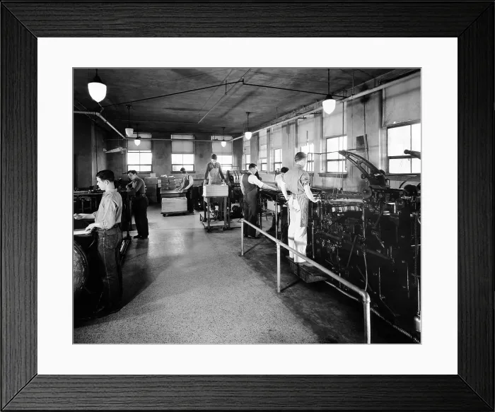 Framed Print : Printing is one of the trades taught Boys Town citizens. Boys are shown here putting out their semi-monthly issue of the Boys Town Times. 1944