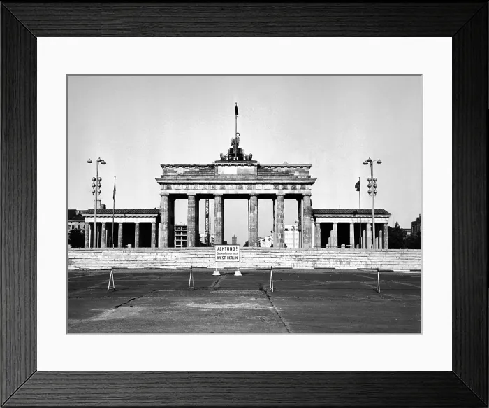 Framed Print : The Brandenburg Gate in East Berlin behind the Berlin Wall. A sign in German warns of the border between East and West Berlin. Aug. 13, 1965 Framed Print : The Brandenburg Gate in East Berlin behind the Berlin Wall. A sign in German warns of the border between East and West Berlin. Aug. 13, 1965