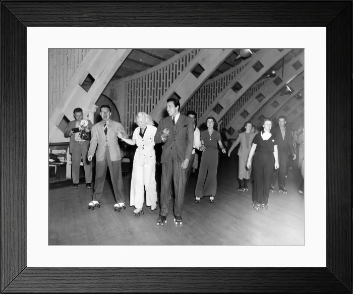 Framed Print : Hollywood stars and socialites at roller-skating party at Roller-Dome in Culver City. L-R: Tom Brown, Toby Wing, and Cesar Romero. June 6, 1936