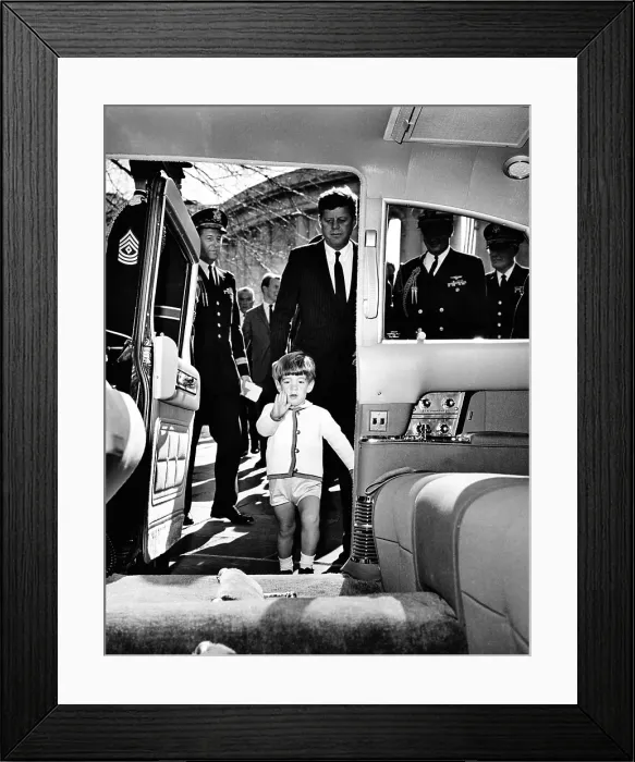 Framed Print : John Kennedy Jr. enters the Presidential Limousine as his father, the President, follows. They were attending Veteran's Day ceremonies at Arlington National Cemetery. Nov