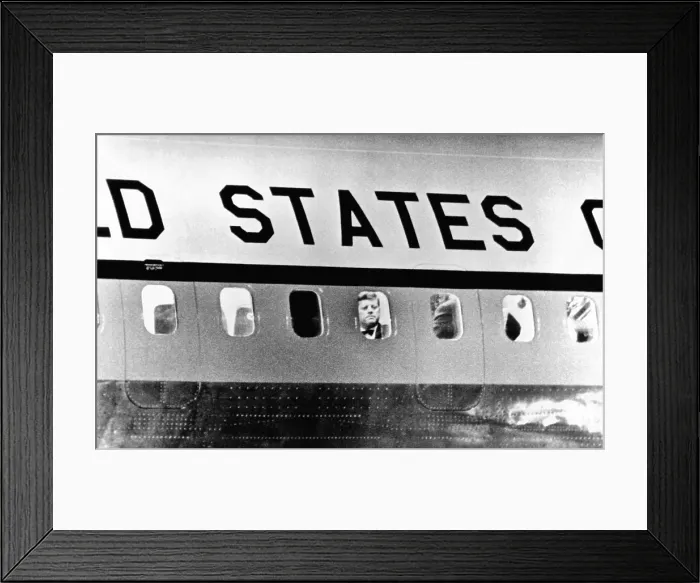 Framed Print : President John Kennedy peers out from window of Air Force One. He was leaving for Paris to meet with French President de Gaulle and then with Soviet Premier Khrushchev in Vienna