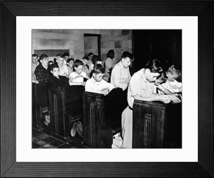 Framed Print : Boys Town citizens bow their heads in prayer for the Father Flanagan. Founder of Boys Town died recently In Germany while inspecting European youth organizations. May 15, 1948