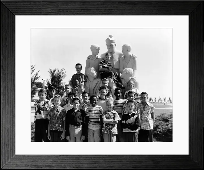 Framed Print : The Soprano Section of the Boys Town Choir is made up of the younger residents, who gather around a statue of Father Flanagan