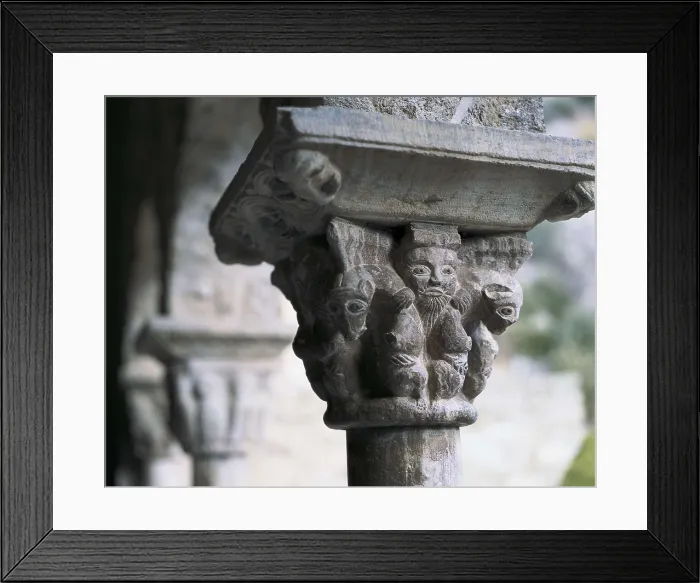 Framed Print : Monastery of Sant Mart del Canig. Cloister. 11th c. - 13th c. FRANCE. Casteil. Abbey of Sant Mart del Canig. Cloister capital with profane scene. Romanesque art. Relief on marble