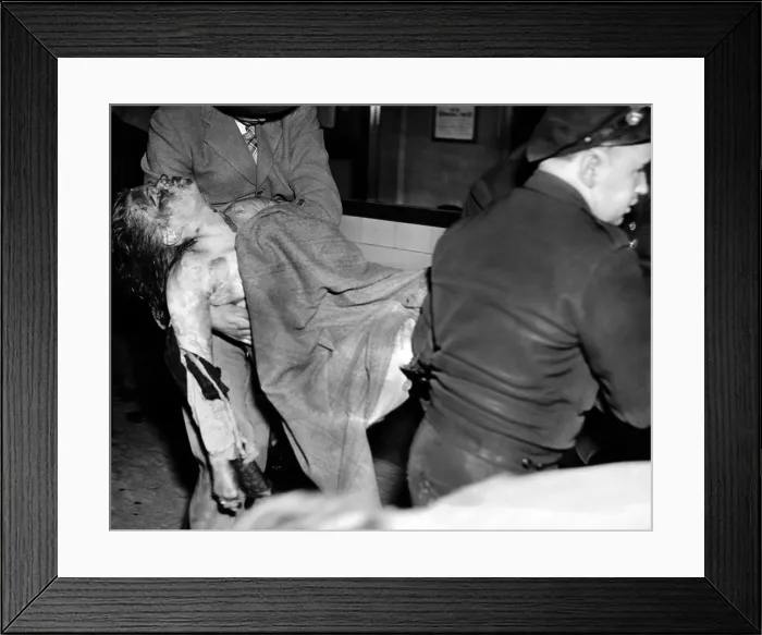 Framed Print : Coconut Grove Nightclub Fire. The body of a young female victim is removed from the nightclub. Nov. 28, 1942. (CSU_ALPHA_1665) CSU Archives / Everett Collection