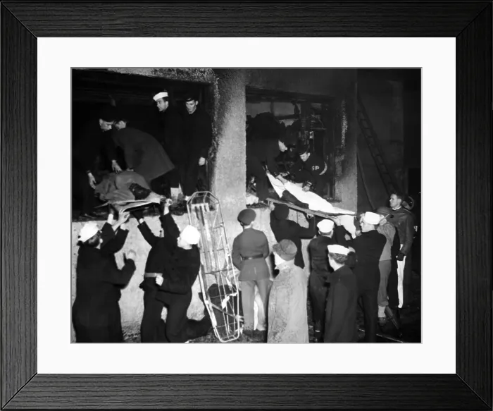 Framed Print : Coconut Grove Nightclub Fire. Service men assist in the removal of bodies from through the charred windows of the burned out building. Nov. 29, 1942