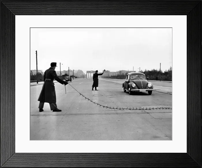 Framed Print : East Berlin customs police stopping a Volkswagen on the Charlettenburger Chaussee with a tire puncturing heavy barbed chain. Oct. 26, 1952 Framed Print : East Berlin customs police stopping a Volkswagen on the Charlettenburger Chaussee with a tire puncturing heavy barbed chain. Oct. 26, 1952