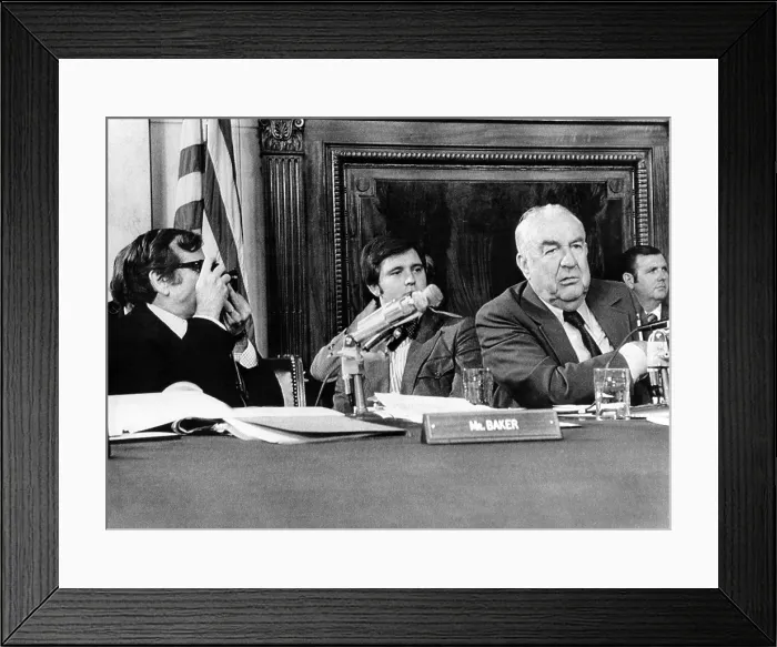 Framed Print : Senate Watergate Committee. Vice Chairman Howard Baker, an amateur photographer, borrowed a newsman's camera to take a picture of Chairman Sam Ervin. July 13, 1973