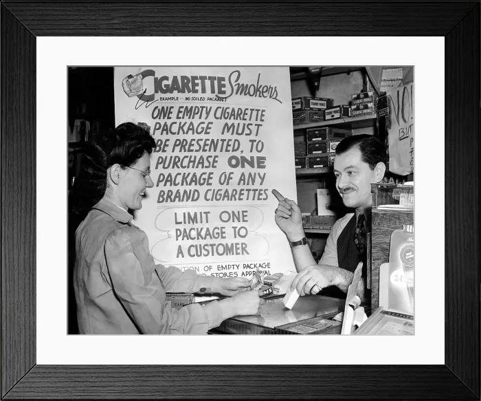 Framed Print : Solution for the wartime cigarette shortage. Ted Pollack, a drug store manager, wants to keep his cigarettes off the black market