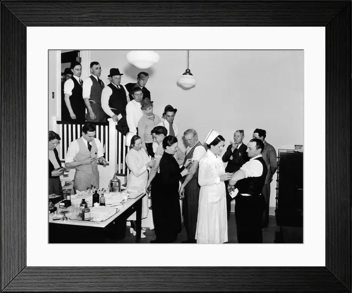Framed Print : Hartford, Connecticut, residents are inoculated against typhoid fever. The city's water supply was compromised by record spring floods. March 22, 1936
