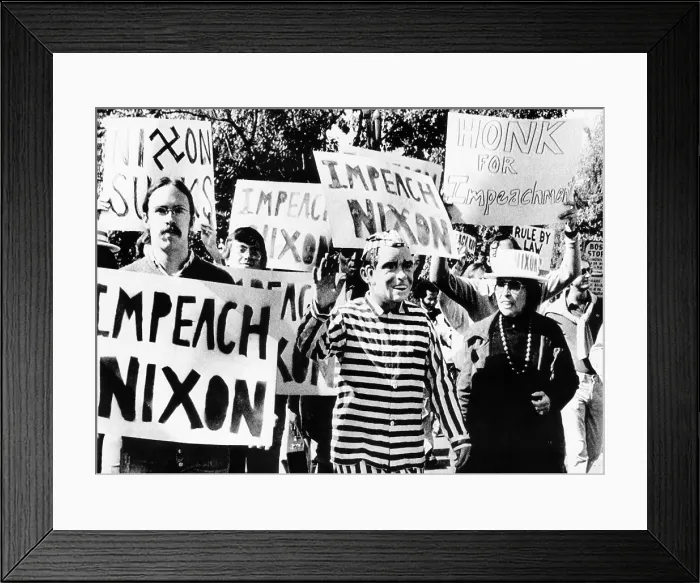 Framed Print : Anti-Nixon demonstrators at the White House. One demonstrator wears a Nixon mask and a striped prison uniform