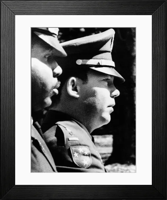 Framed Print : Lt. William L. Calley, Jr. escorted to the Fort Benning stockade on March 31, 1971. He had just heard the jury pronounce a life sentence term Framed Print : Lt. William L. Calley, Jr. escorted to the Fort Benning stockade on March 31, 1971. He had just heard the jury pronounce a life sentence term